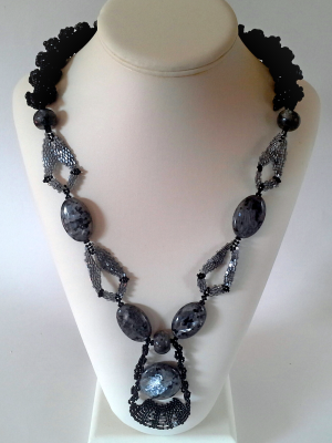Galactic Fugue, an ornate and highly textured bead woven necklace in black and white, 2017, Patricia C Vener 